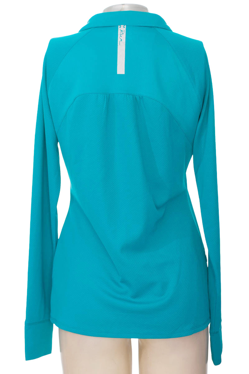 Ropa Deportiva / Salida de Baño color Aguamarina - Under Armour