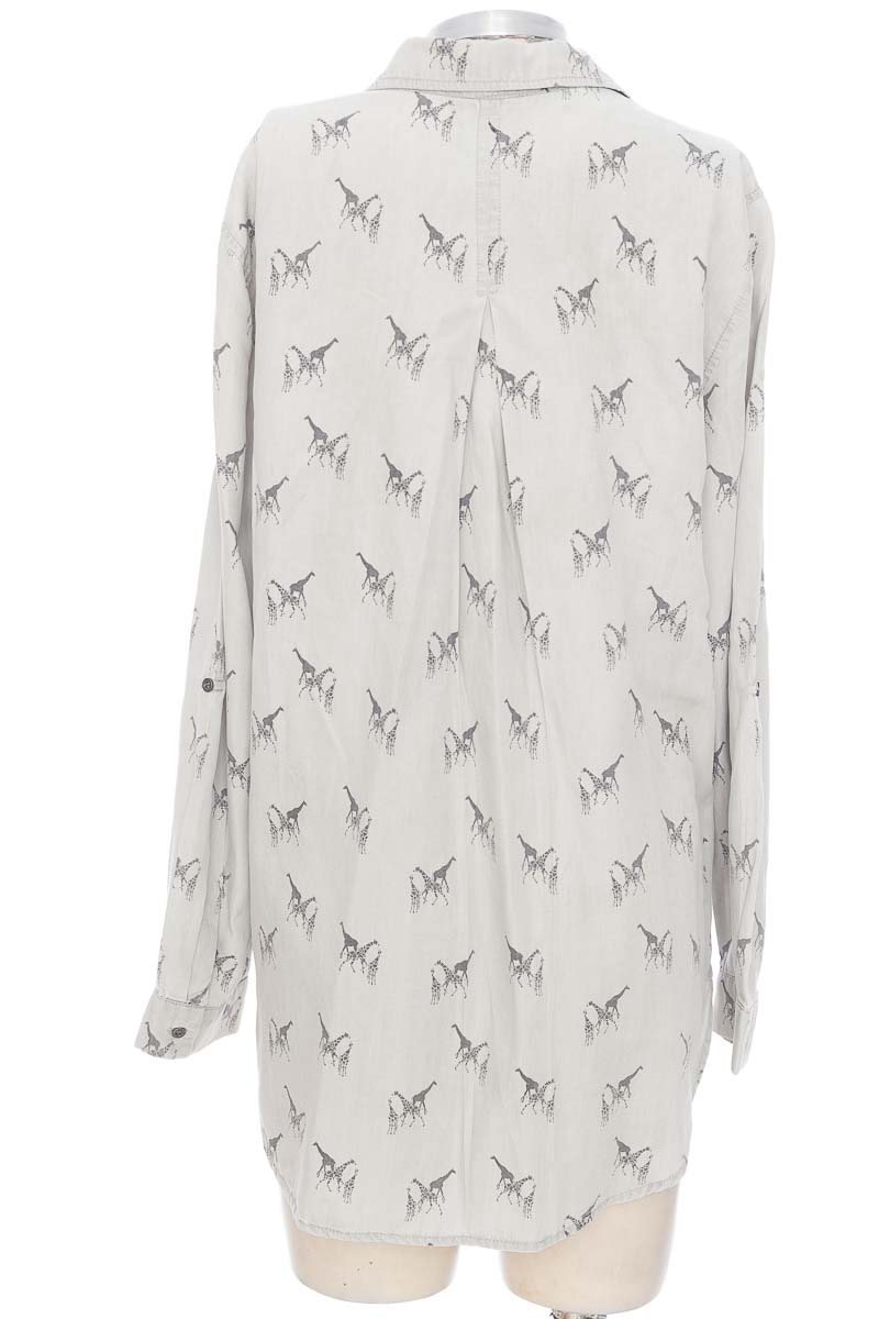 Sweat-shirt imprimé floral. Poches, col montant et manches longues